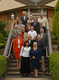 Click on image to see full-sized version Moira Hamblin is the woman in a tasteful shade of orange on the left